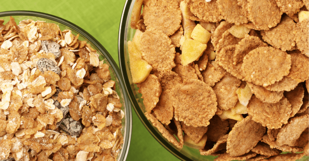 various cereals in bowls on green background