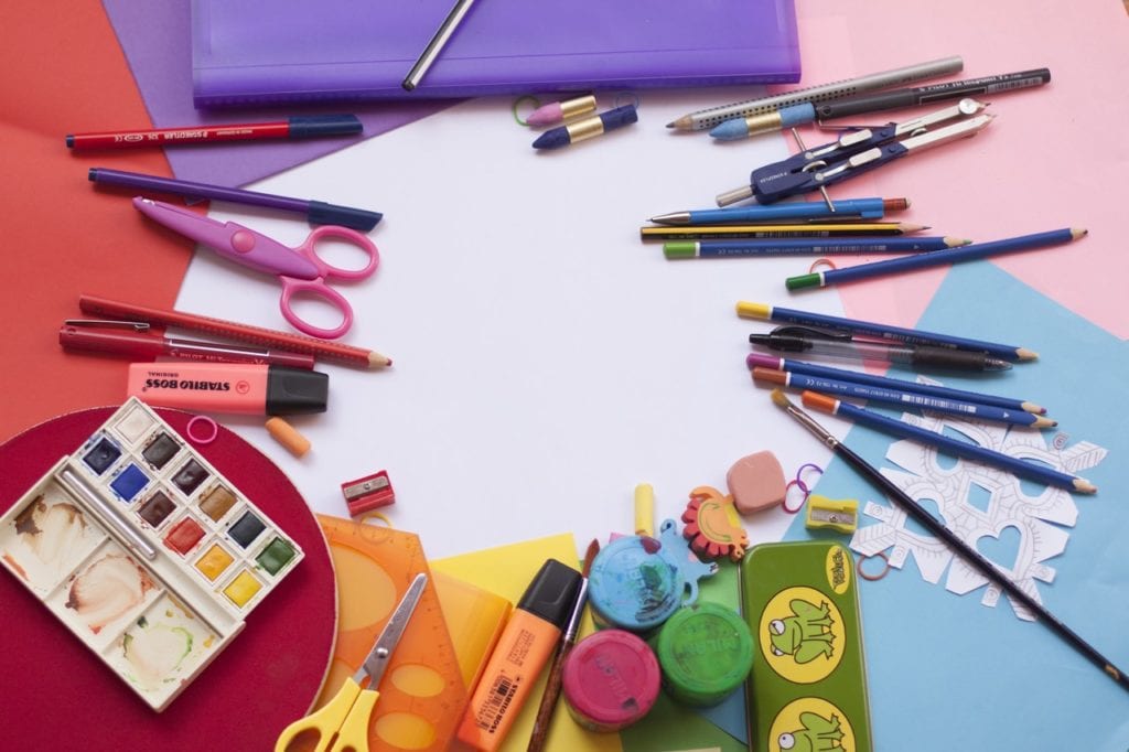colorful school supplies arranged in a circle