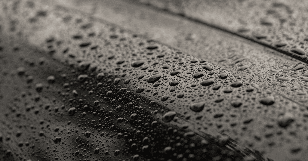 up close of a car with water droplets all over it