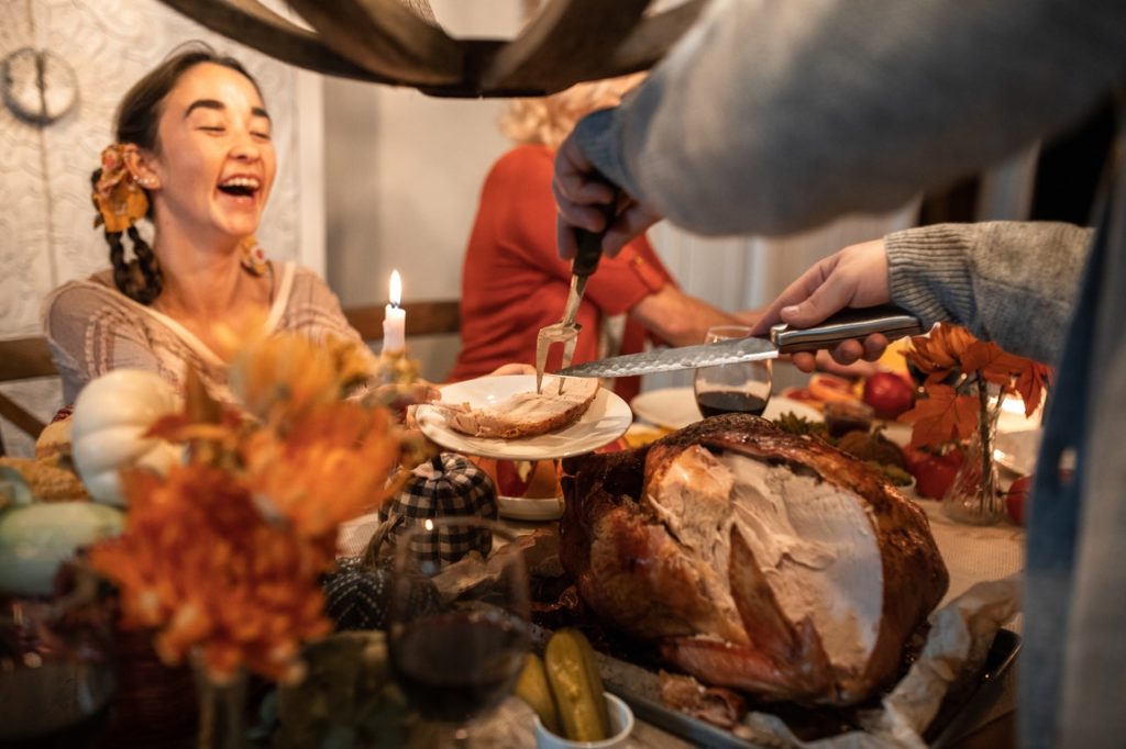 girl looking happy at a thanksgiving dinner