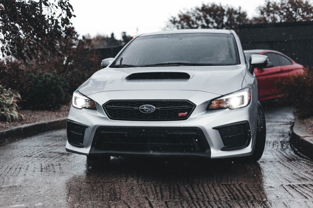 silver subaru on rainy day