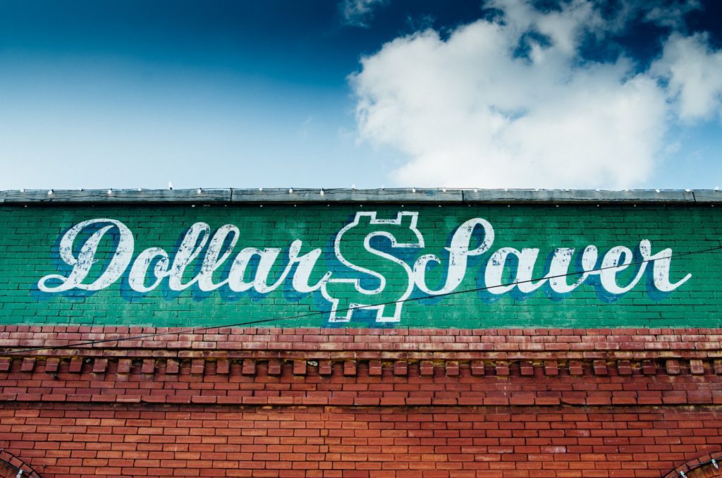 dollar saving on brick wall